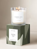Candle on top of gift box. - Image 