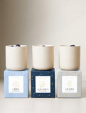 Three candles on top of gift boxes. - Image 
