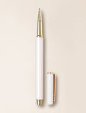 Beige and gold pen on beige background. - Image 