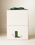 Beige gift box with an imprint and green bow. - Image 