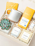 Congrats gift box featuring a succulent, speckled ceramic mug, artisan chocolate, a vanilla candle, and matches in a crate. - Image 