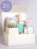 Mother's Day gift box with a succulent, ceramic mug, Petal Blush candle, Edith Grey tea, and matches in a cream box. - Image 