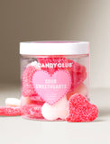 Clear plastic jar filled with red and white sugar-coated heart-shaped sour candies labeled Candy Club Sour Sweethearts. - Image 