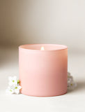 Pink candle with a wick on a light background - Image 