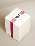 Gift box with ribbon and occasion tag. - Image 