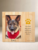 A personalized bamboo pet memorial plaque featuring a photo of a German Shepherd wearing a red bandana, with the name 'Lucy' and a gold paw print with a heart on a beige background. - Image 