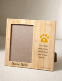 A personalized bamboo pet memorial photo frame with a yellow paw print and heart design, featuring the text 'Your little paw prints will forever stay in our hearts.' and 'Name Here' on a neutral beige background. - Image 