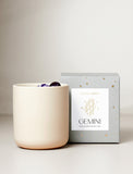 Candle next to gift box. - Image 