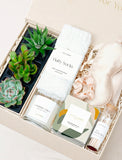 Lula's Garden gift box featuring three succulents, white fluffy socks, a vanilla candle, silk sleep mask, scrunchie, and matches. - Image 