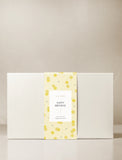 Gift box with yellow gift wrap. - Image 