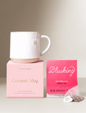 Speckled white ceramic mug with a pink gift box and Big Heart Tea hibiscus herbal tea sachets. - Image 