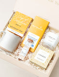 Congrats gift box containing a ceramic mug, herbal tea, Moonstruck chocolate, a vanilla candle, and matches in a gift set. - Image 
