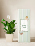 Plant in ceramic planter next to gift box. - Image 