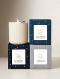 Candle on top of gift boxes. - Image 