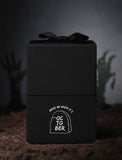 Black gift box with imprint and black bow. - Image 