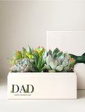 Assorted succulents in a cream-colored gift box labeled DAD Happy Father's Day with a dark green ribbon. - Image 