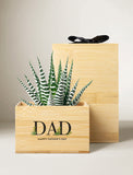 Zebra succulent in a bamboo planter engraved with DAD Happy Father's Day text and a black gift box. - Image 